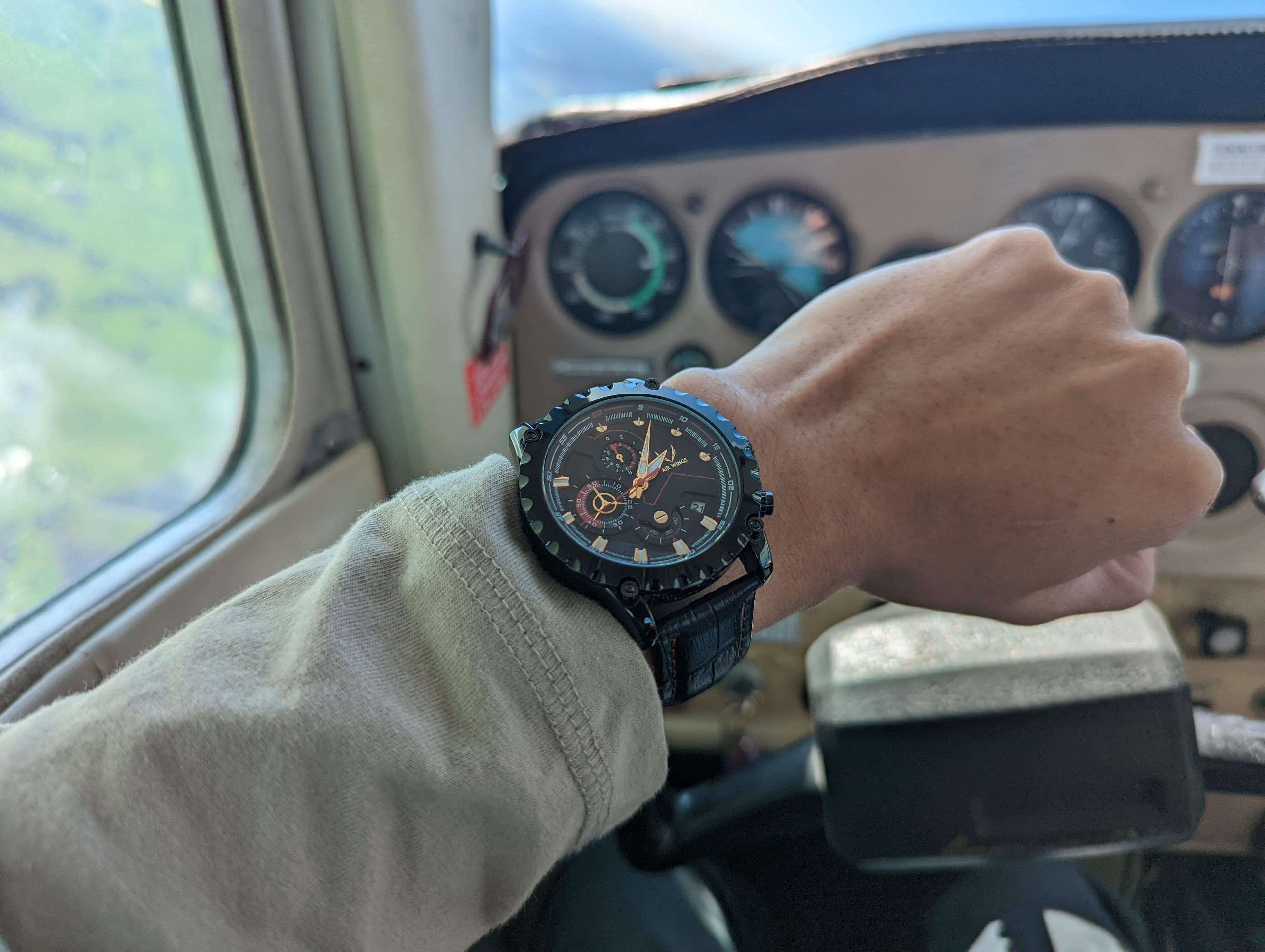 Air Wings Ace - Gold/Black showcased on wrist in cockpit, perfect for minimalistic pilot watches Perth.